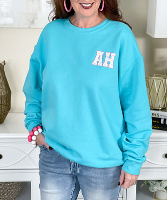 monogrammed pocket pink bows sweatshirt close up