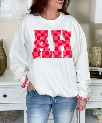 pink and red checkered monogram sweatshirt close up