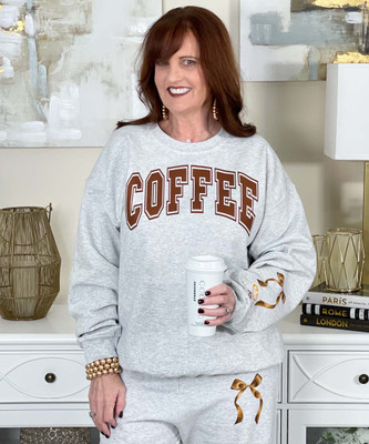coffee with monogrammed cup on sleeve sweatshirt