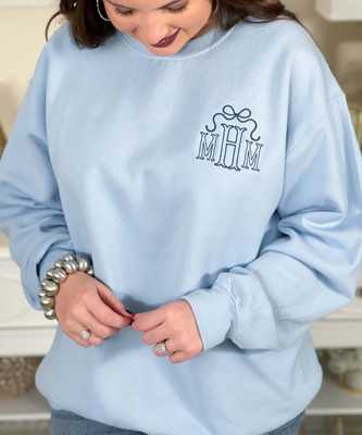 embroidered blue fishtail monogram with bow sweatshirt close up