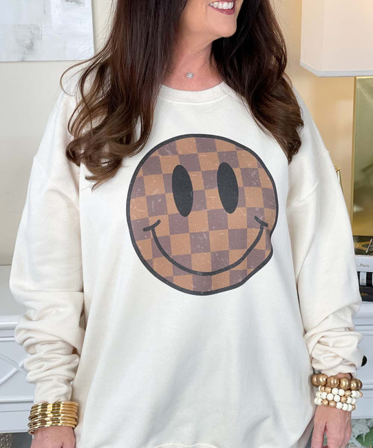 brown checkered smile sweatshirt close up