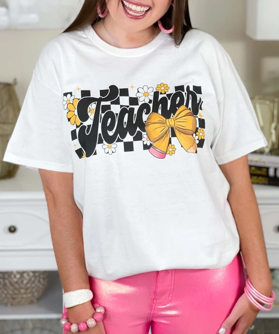 checkerboard teacher with pencil bow tee close up