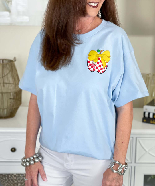 pocket checkerboard apple with pencil bow tee close up