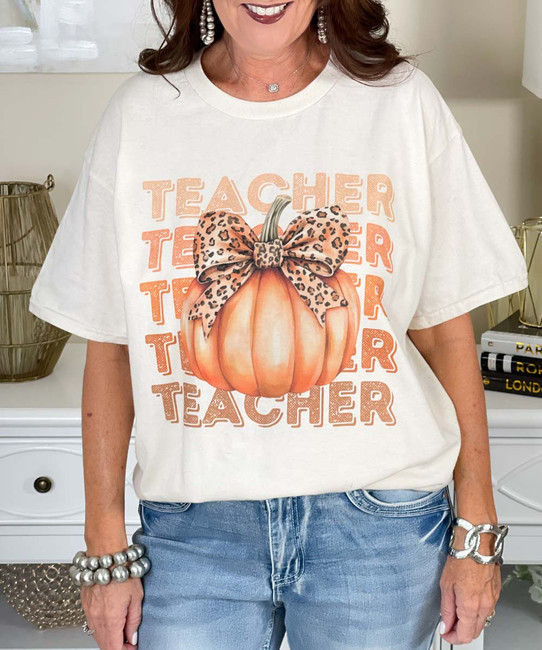 teacher pumpkin with bow tee close up