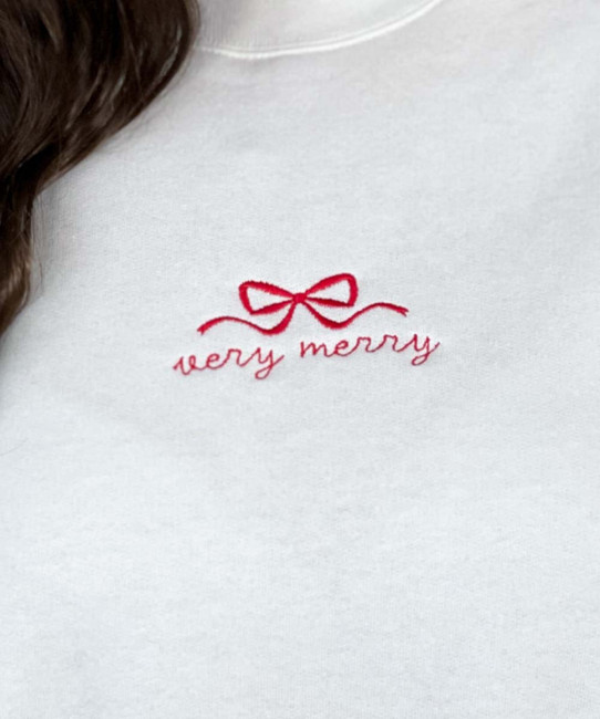 embroidered very merry with bow sweatshirt close up of embroidery design