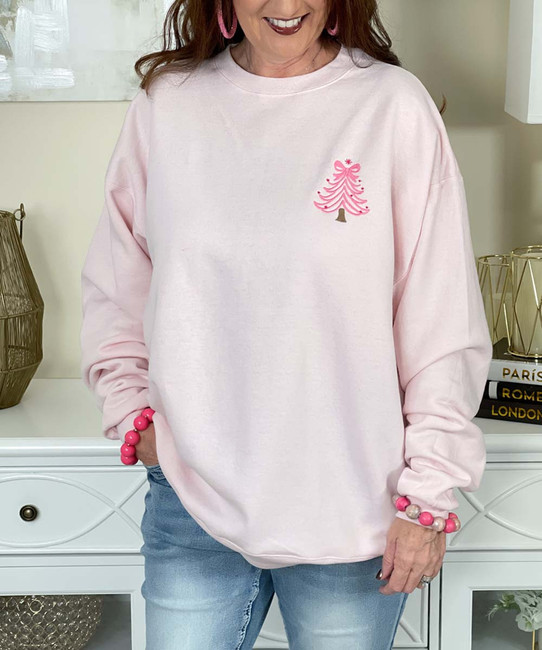 embroidered pink christmas tree sweatshirt close up