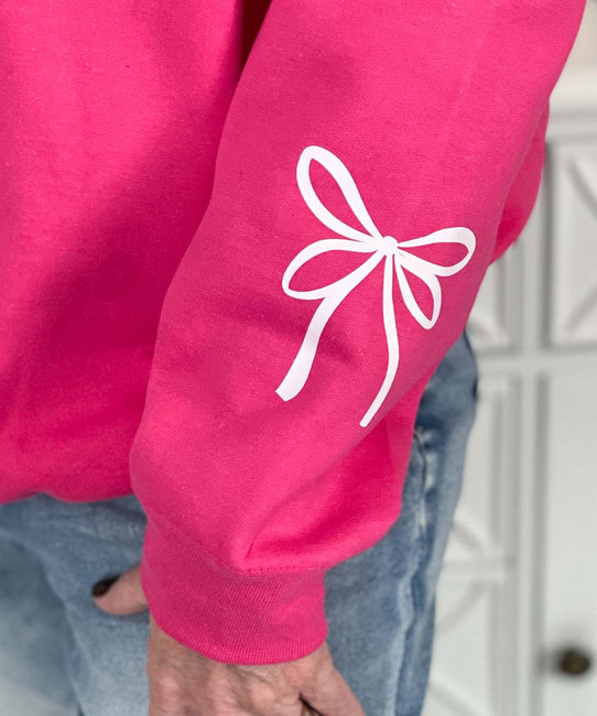 monogrammed white bow with bow on sleeve sweatshirt close up of sleeve