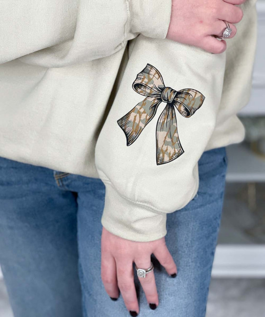 monogrammed camo bow with bow on sleeve sweatshirt close up of sleeve