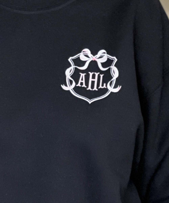 monogrammed pocket pink crest sweatshirt close up of monogram