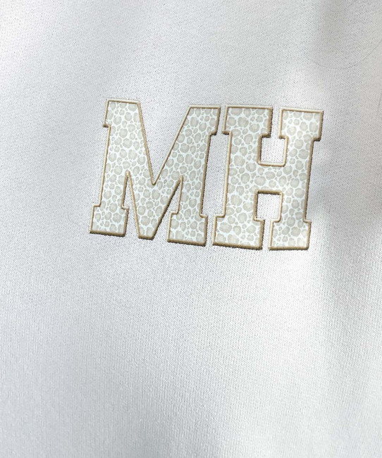 light leopard monogram sweatshirt close up of monogram