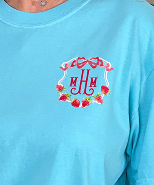 monogrammed strawberry crest comfort colors tee close up of monogram