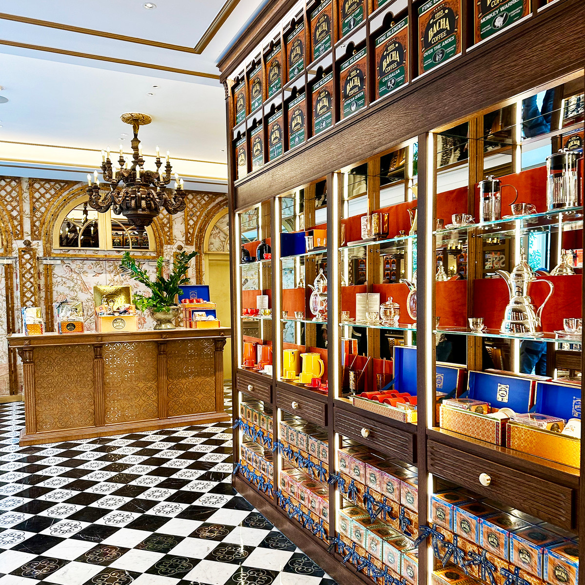 Bacha Coffee – Shelves lined with beautifully presented coffees and gift collections showcase the brand’s global coffee heritage, inviting visitors to explore origins from across the world.