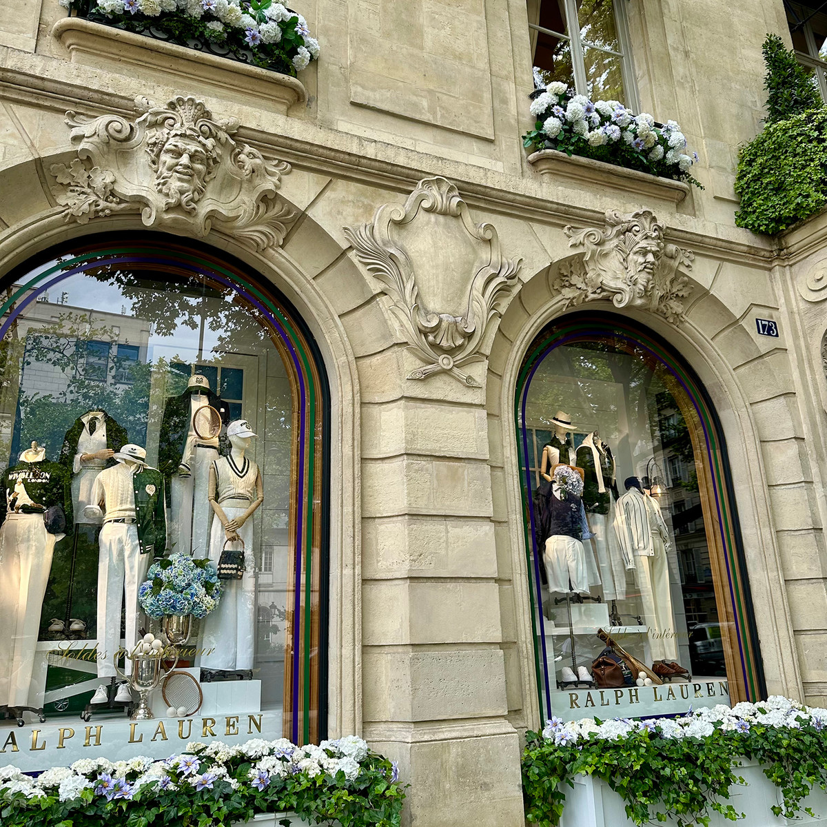 Ralph Lauren windows in Saint-Germain — seasonal elegance framed in Parisian stone and florals.