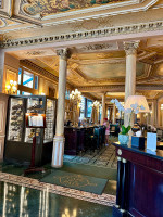 A discreet entrance opening into one of Paris’s most timeless dining rooms.