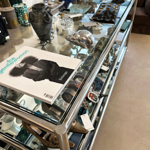Curated displays of vintage fashion, books and design objects reflect Rue du Temple's creative shopping culture.