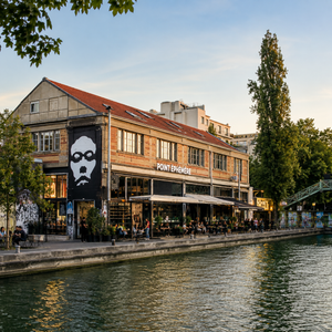 Point Éphémère, an indie arts center and concert venue along Canal Saint-Martin in Paris, known for its creative energy and underground music scene — explore Paris off the beaten path with TLC Paris concierge service.