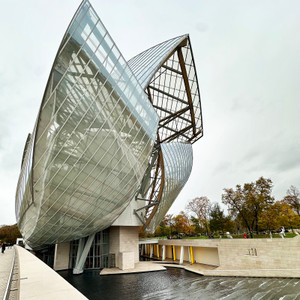 Frank Gehry’s sails rising against a muted sky — powerful, even without the sun.
