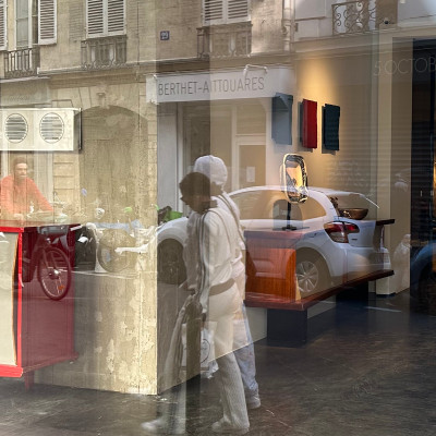 The gallery becomes part of the street
Reflections of bicycles, pedestrians and limestone façades transform the gallery windows into temporary works of art of their own.