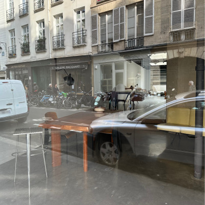 The gallery becomes part of the street
Reflections of bicycles, pedestrians and limestone façades transform the gallery windows into temporary works of art of their own.