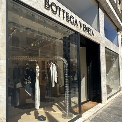 Minimalism finds its place among the grand maisons of Rue du Faubourg Saint-Honoré. Bottega Veneta's understated storefront reflects the brand's signature approach: quiet luxury, exceptional materials, and craftsmanship that speaks softly rather than loudly.