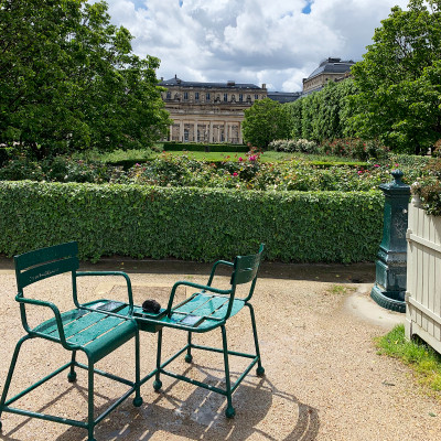 Green chairs, rose gardens, and hidden corners make the Palais Royal Garden a favorite place to pause, read, or simply enjoy a slower side of Paris.