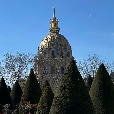 Seen from the gardens of Musée Rodin, the golden dome of Les Invalides rises above one of the most peaceful green spaces in central Paris.