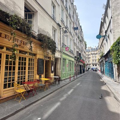 Rue Princesse captures the village spirit that still survives in parts of Saint-Germain-des-Prés. During the day, cafés and bistros spill onto the pavement beneath colorful storefronts, while the surrounding streets gradually come alive for aperitifs, dinner, and nightlife as the sun goes down."