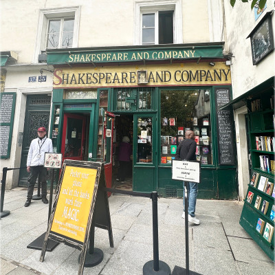The Entrance to Literary Paris
A queue forms outside the legendary Shakespeare and Company, where visitors are invited to put away their phones and lose themselves among thousands of books. Inside, narrow rooms, hidden corners, and creaking staircases create a world that feels untouched by time.
