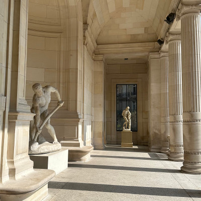 Inside Palais Galliera — light, stone, and sculpture shaping a refined setting for fashion as cultural expression.
