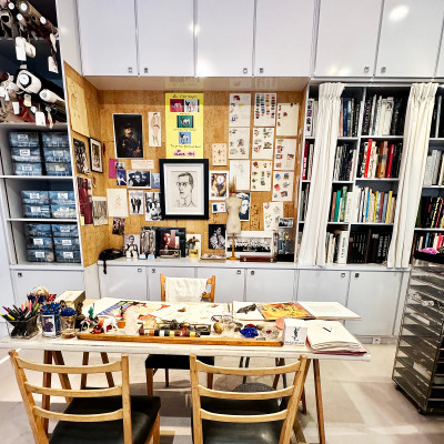 Inside the Creative Process
Sketches, books, photographs and personal references offer a glimpse into the world behind the collections. The recreated workspace reveals the research, inspiration and meticulous preparation that shaped Yves Saint Laurent's creative vision.