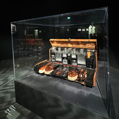A curated selection highlights Louis Vuitton’s travel history, offering a glimpse into its iconic craftsmanship