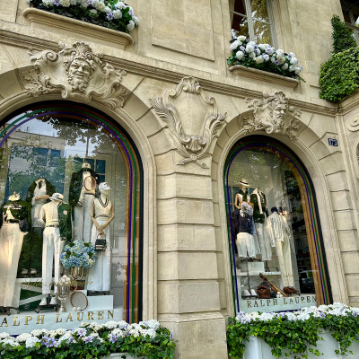 Ralph Lauren windows in Saint-Germain — seasonal elegance framed in Parisian stone and florals.