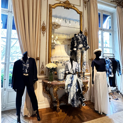 Elegant women's collections within the refined interiors of the grand showroom.