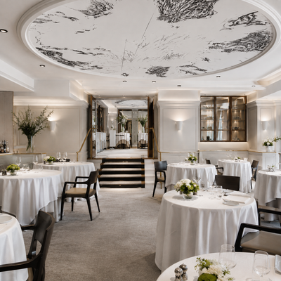 A glimpse into the avant-garde world of Pierre Gagnaire, where each plate is a poetic expression of French haute cuisine. The image highlights the refined yet contemporary interior of this three Michelin-starred Parisian restaurant, with artfully arranged dishes that celebrate innovation, texture, and flavor. A masterclass in culinary artistry set in a chic, intimate ambiance. Captured for TLC Paris.