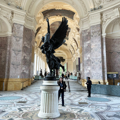Marble, mosaics, and soaring ceilings create an unforgettable first impression inside Petit Palais's spectacular central hall.