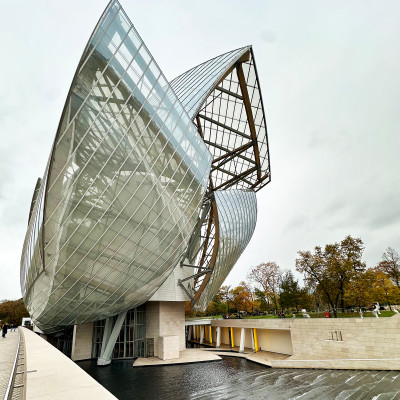 Frank Gehry’s sails rising against a muted sky — powerful, even without the sun.