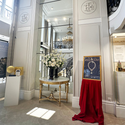 Natural light, crystal chandeliers and fresh floral displays lend a sense of quiet grandeur to the entrance hall of La Maison Élysée.