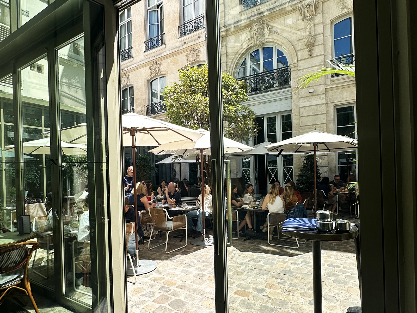 The leafy courtyard terrace is one of The Hoxton Paris's hidden gems, serving breakfast, lunch, coffee and cocktails in a peaceful setting away from the city's busy streets.
