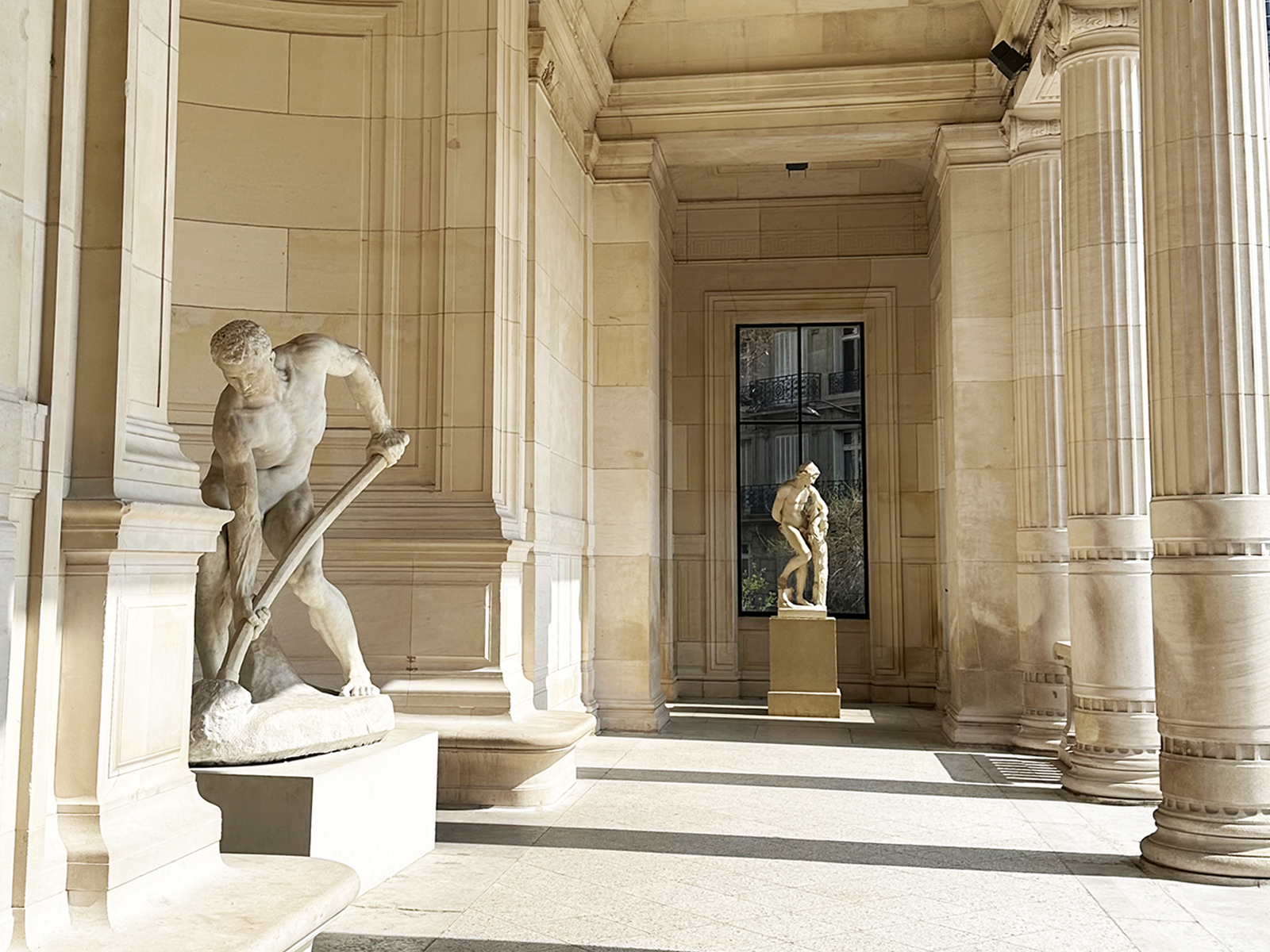 Inside Palais Galliera — light, stone, and sculpture shaping a refined setting for fashion as cultural expression.