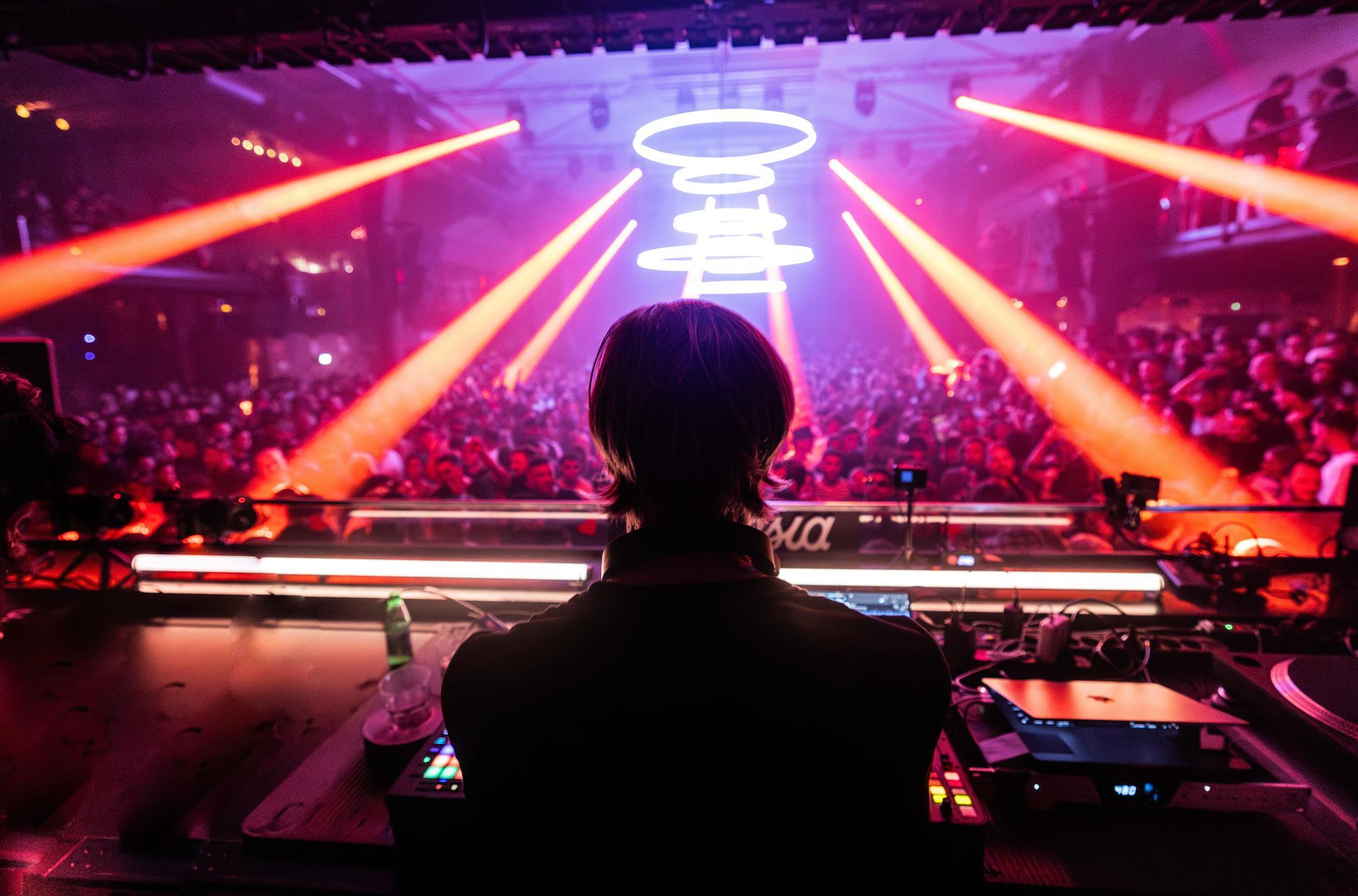 DJ overlooking a nightclub crowd