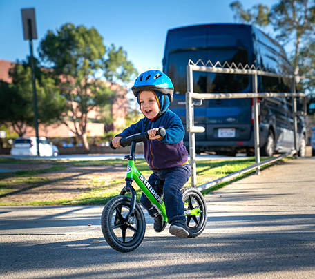 Child on balance bike