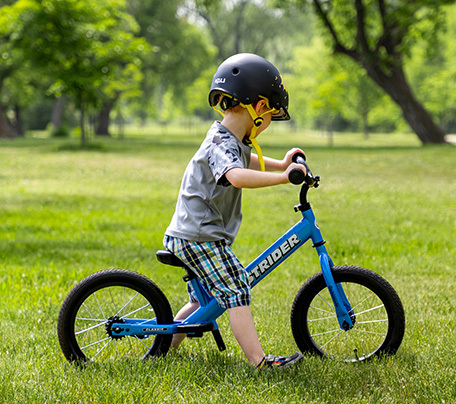Child on balance bike