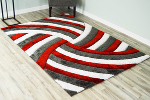 Full view of the pinwheel shag rug laid out showing detail.