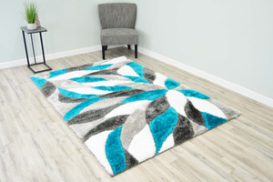 Full view of the turquoise mosaic shag rug laid out showing detail. Full view of the turquoise mosaic shag rug laid out showing detail.
