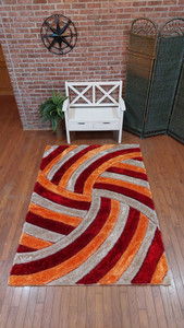 View of the rug laid out showing detail and design. View of the rug laid out showing detail and design.