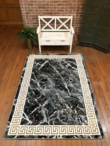 Full view of the rug laid out showing design details.