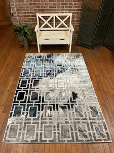 Full view of the rug laid out showing design details.