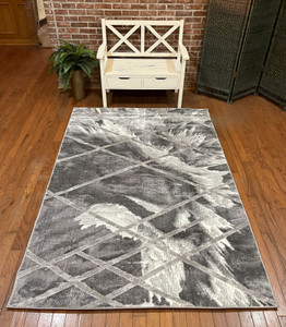 Full view of the rug laid out showing design details.