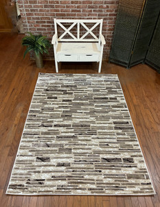 Full view of the rug laid out showing design details.