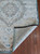 Corner of the rug is flipped up showing the detail on the bottom of the rug. Corner of the rug is flipped up showing the detail on the bottom of the rug.